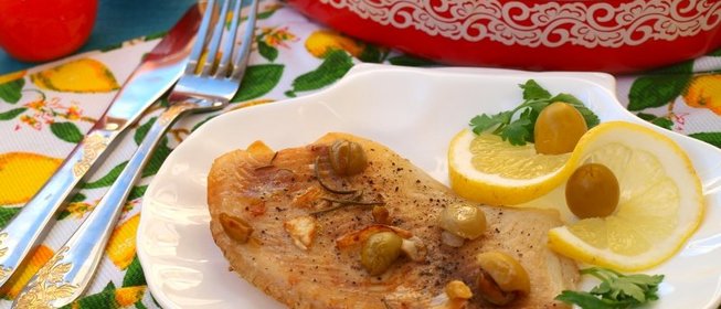 Филе тилапии запечённое с лимоном и оливками