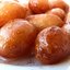 Сладкие пончики лукумадес (локма) в сиропе